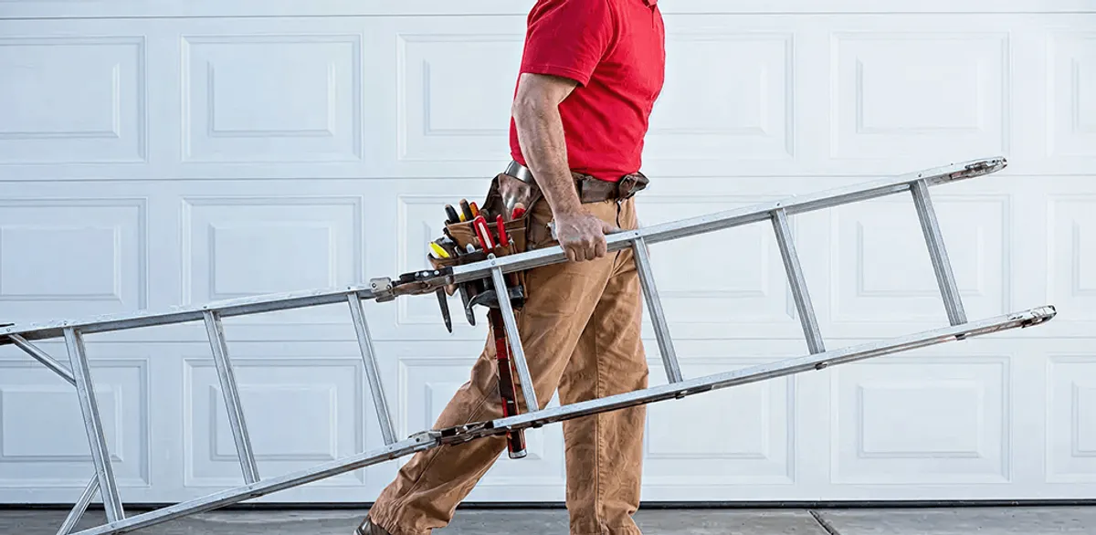 Garage door repair technician arriving with tools and ladder in Bradenton, FL